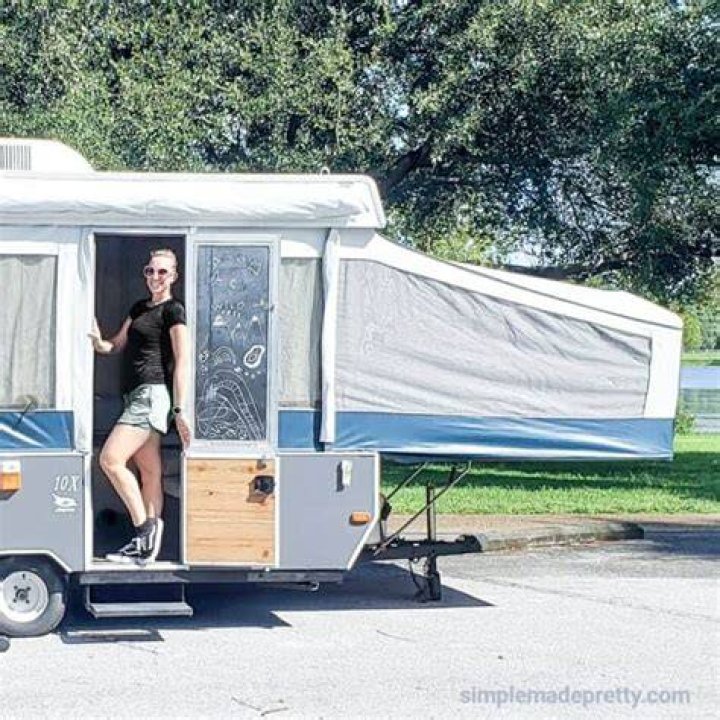 How do you open a pop up camper door without a key?